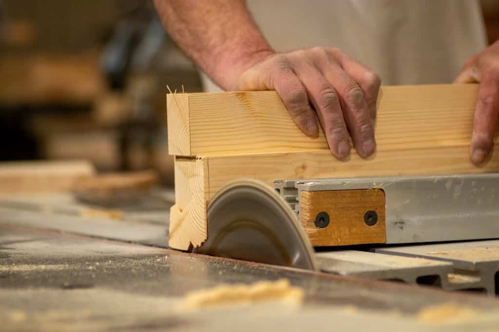 Hands Cutting Wood