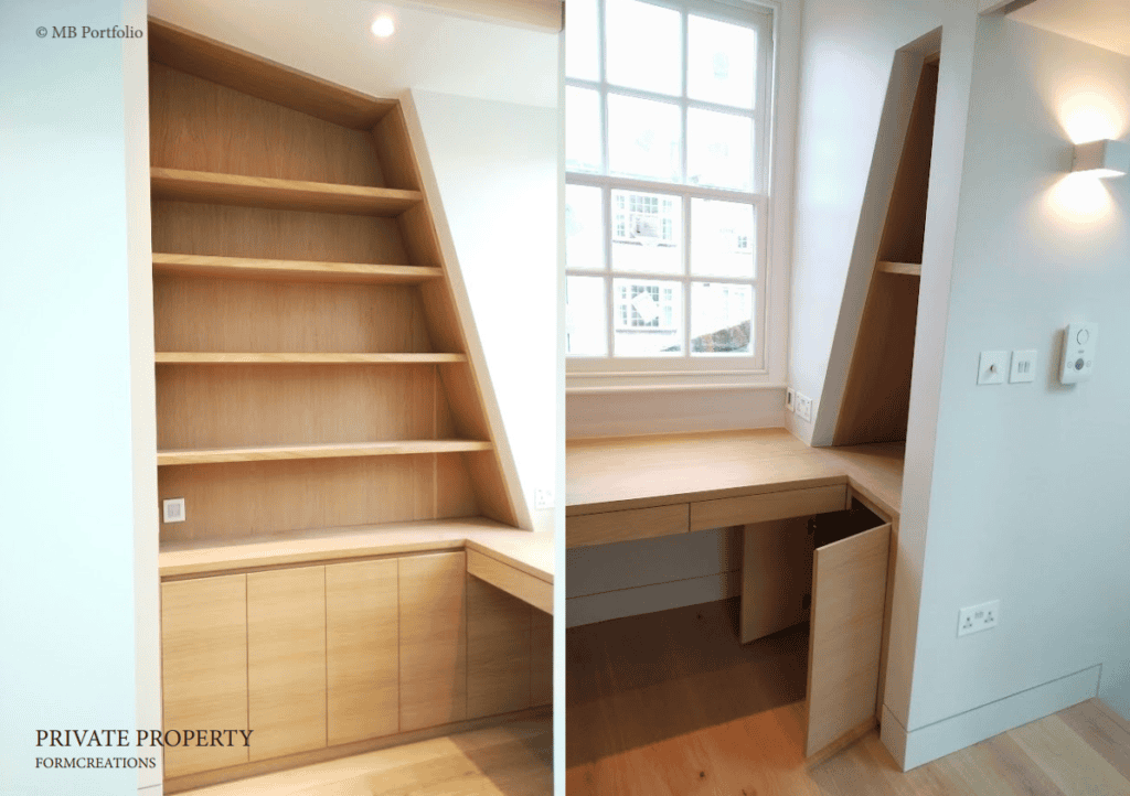 A modern, custom-built corner workspace with shelving and cabinets in a light wood finish, located next to a window with natural light enhancing the area.